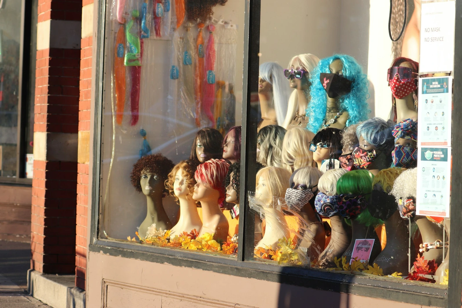 assorted color of doll in display cabinet
